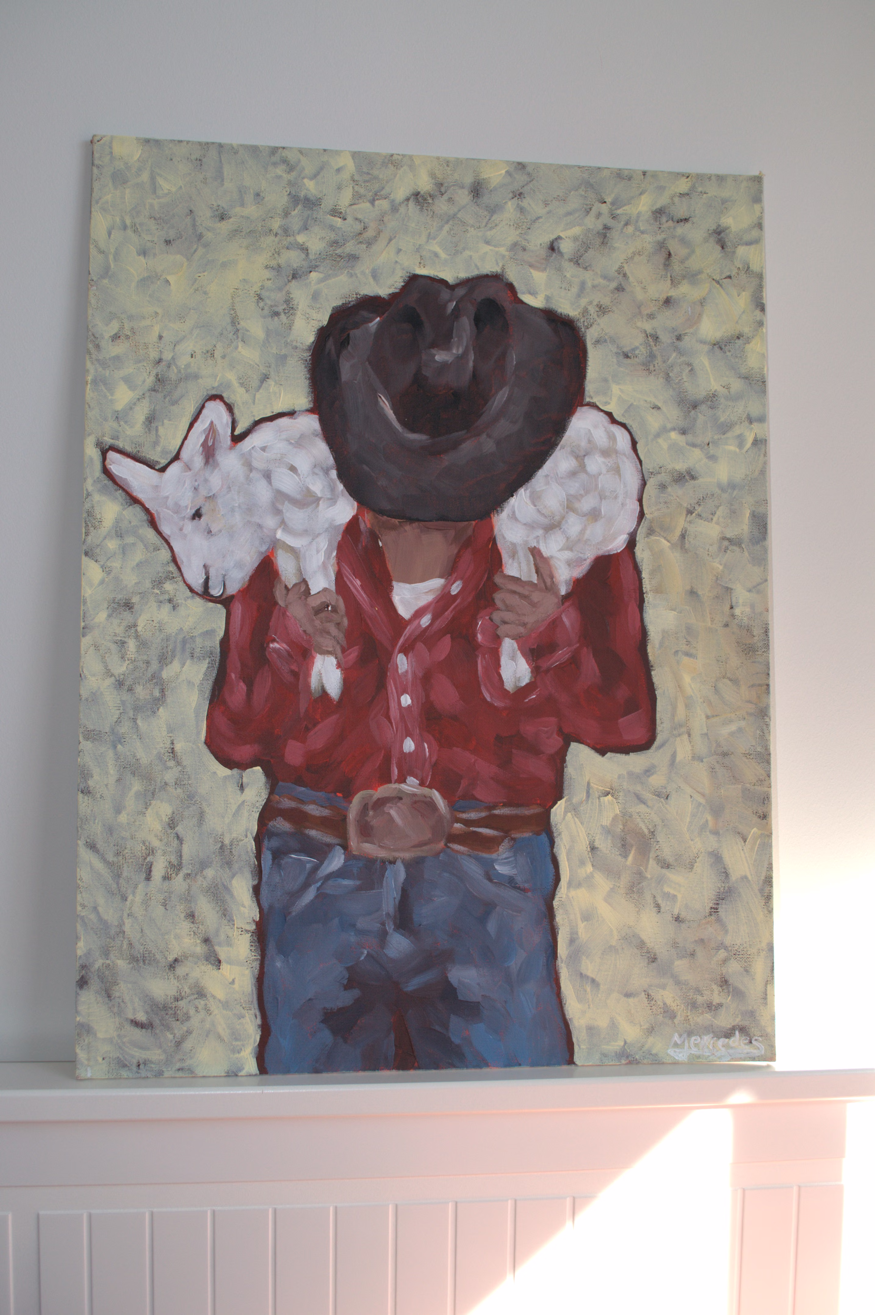 Cowboy carrying a lamb by Mercedes Michel — alternate view 1