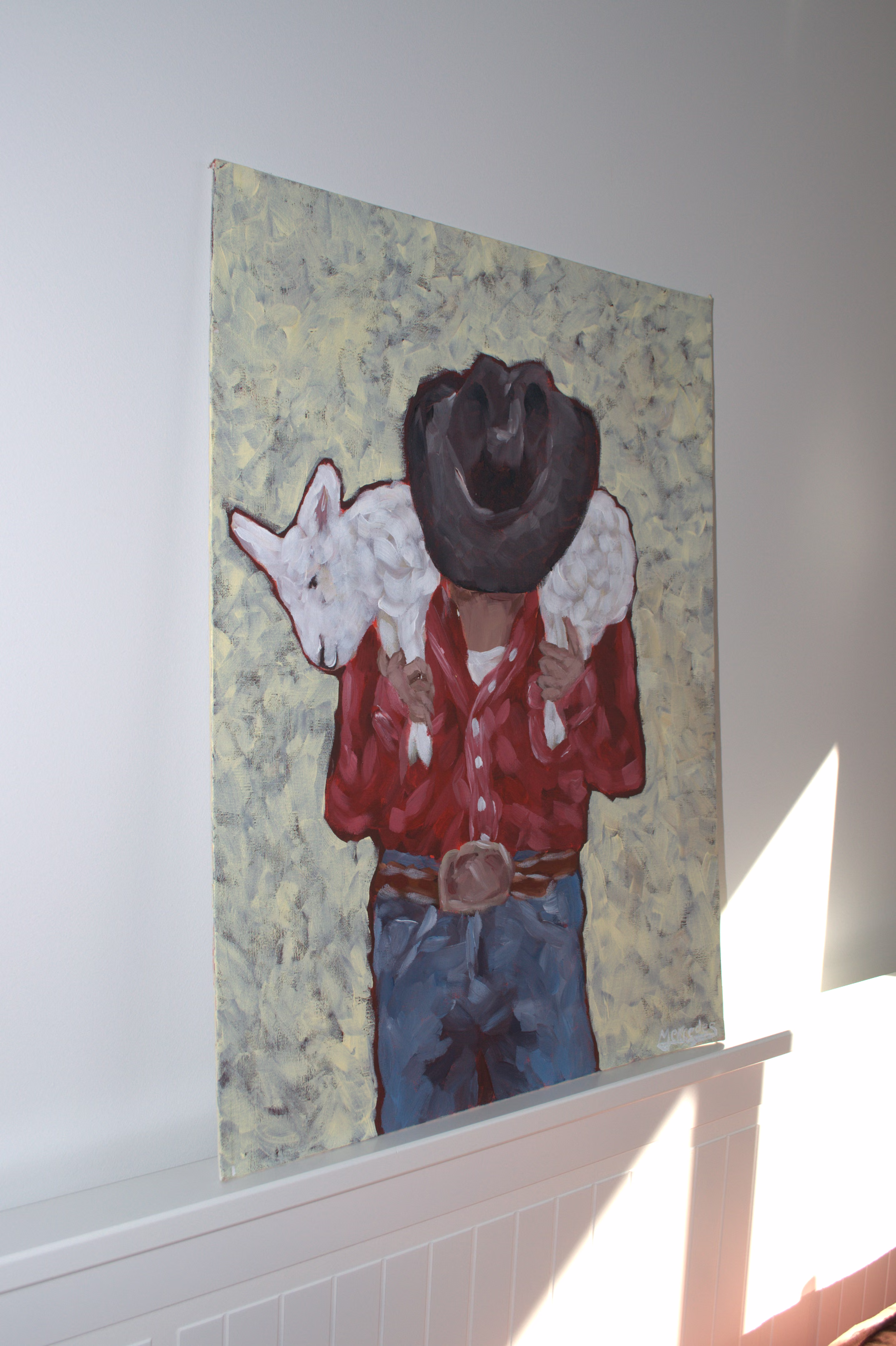 Cowboy carrying a lamb by Mercedes Michel — alternate view 2