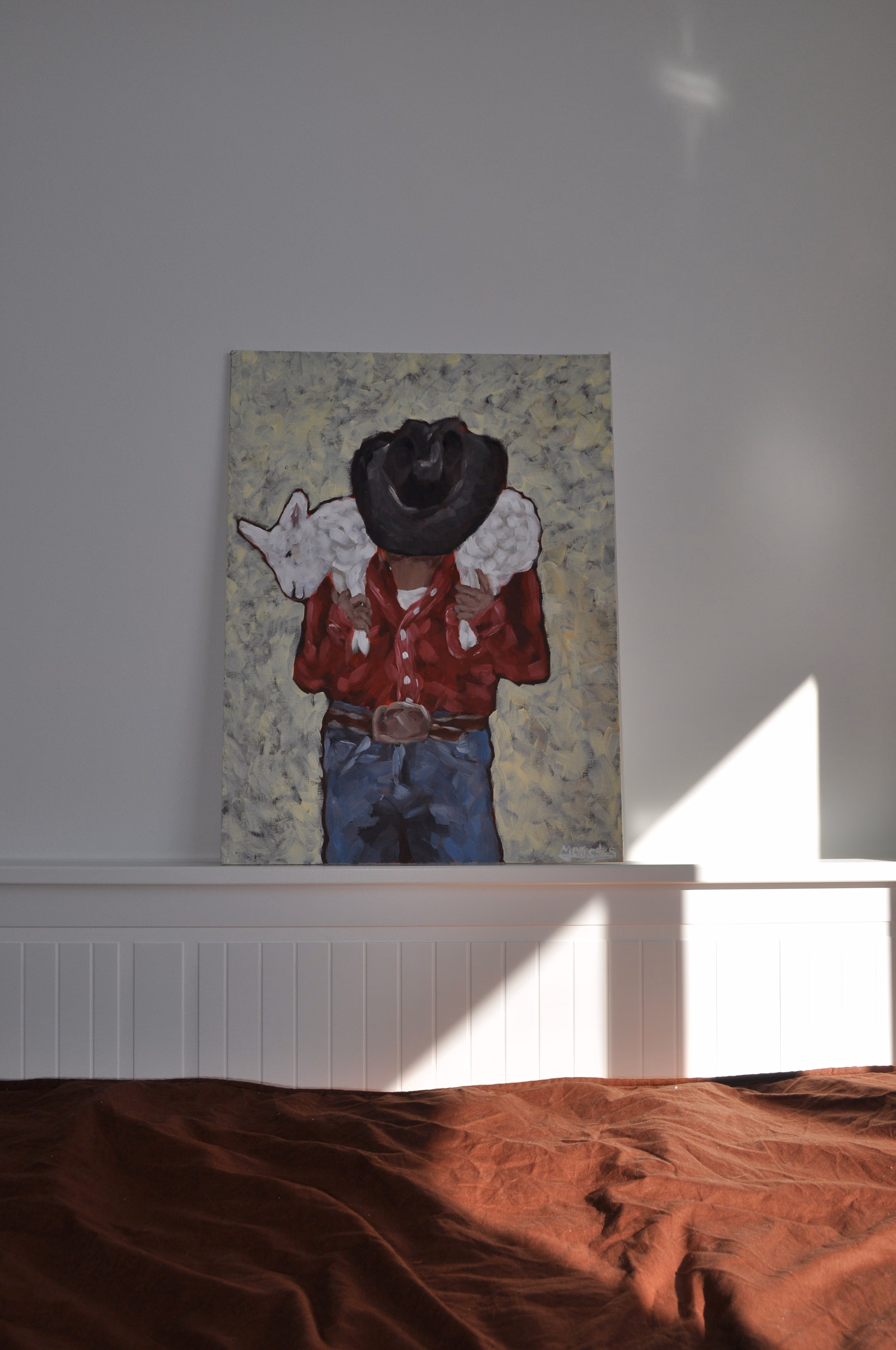 Cowboy carrying a lamb by Mercedes Michel — alternate view 4